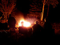 Family training around a campfire